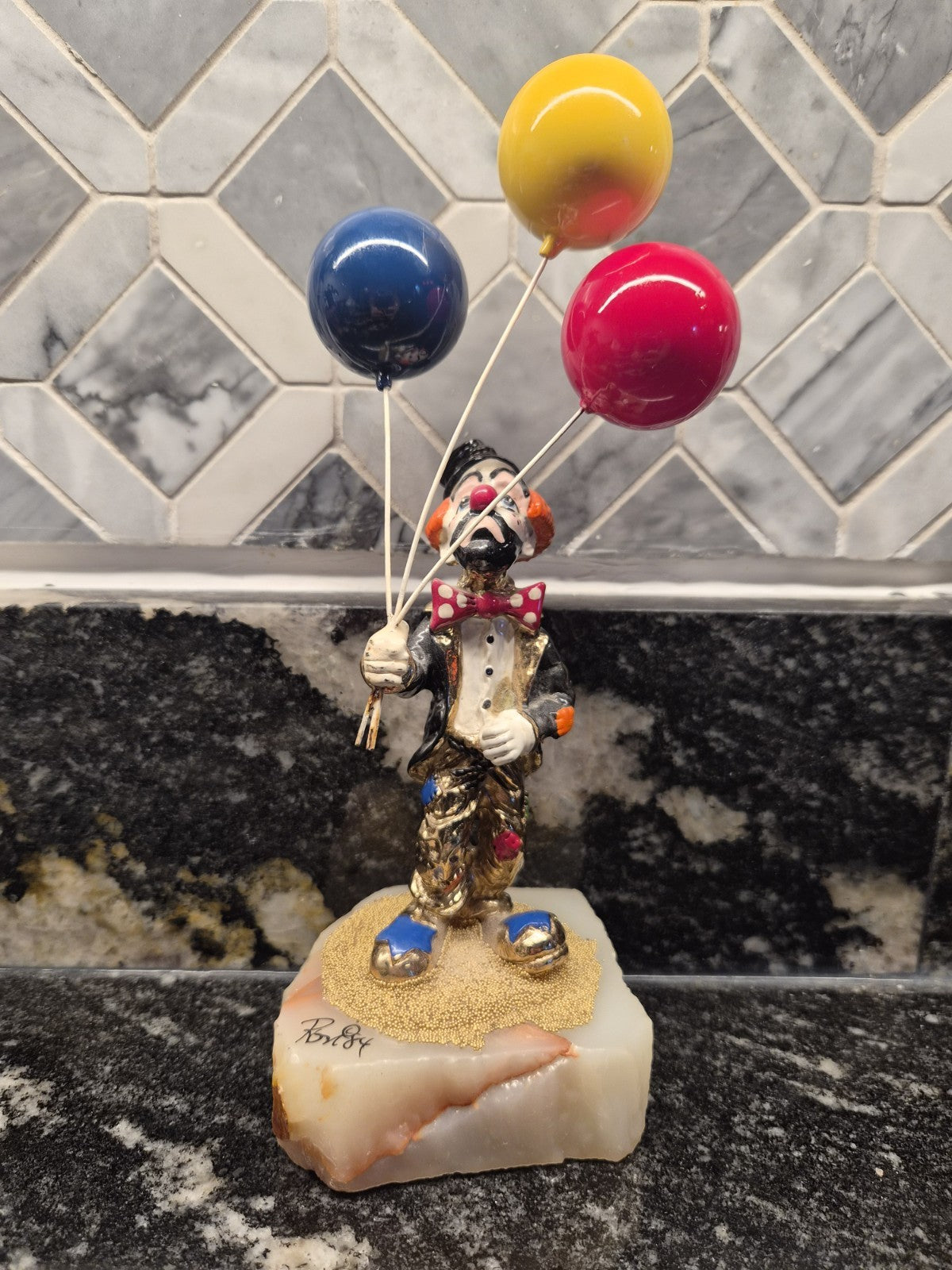 a vintage Ron Lee signed clown sculpture titled "Hobo Joe with Balloons."